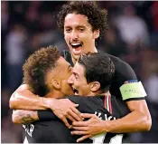  ??  ?? Above: Paris Saint-Germain’s Argentine midfielder Angel Di Maria (right) celebrates with teammates after scoring a goal during their Champions League match against Napoli at the Parc des Princes stadium in Paris on Wednesday. The match ended 2-2.