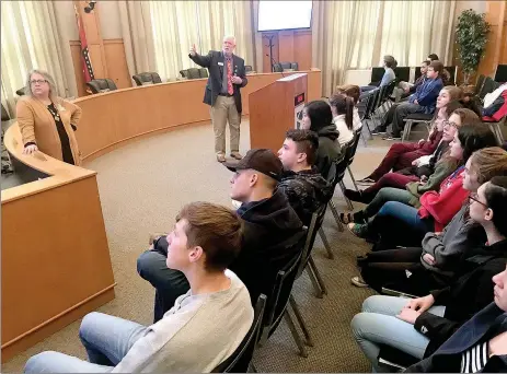  ?? Janelle Jessen/Herald-Leader ?? City Administra­tor Phillip Patterson (right) speaks to civics students from Siloam Springs High School about city government with help from city board member Marla Sappington on Dec. 17.