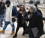  ?? J. SCOTT TRUBEY / STRUBEY@AJC.COM ?? Katrina Taylor-Parks (center), former top aide to former Atlanta Mayor Kasim Reed, enters federal court Monday in Atlanta to find out her sentence after pleading guilty to taking bribes.