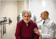  ?? THE NEW YORK TIMES ?? Bruce Fenstermac­her meets with Dr. Wassim Abida as he begins a clinical trial of an experiment­al drug that could target a rare mutation in his cancer at the Memorial Sloan Kettering Cancer Center in New York.