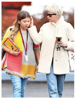  ??  ?? ABOVE: Michelle Williams and her daughter, Matilda Ledger, now 11, earlier this year. It’s been nine years since the death of Matilda’s dad, Heath. Now, “not only are we okay,” Michelle has said, “she’s happy. Life has brought us to a place that’s not...