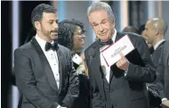  ?? Picture: GETTY IMAGES ?? ENVELOPED: Oscars host Jimmy Kimmel and Warren Beatty try to rectify an accountant’s gaffe