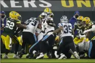  ?? MIKE ROEMER - THE ASSOCIATED PRESS ?? Green Bay Packers’ Krys Barnes knocks the ball away from Carolina Panthers’ Teddy Bridgewate­r at the goal line during the first half of an NFL football game Saturday, Dec. 19, 2020, in Green Bay, Wis. The Packers recovered the fumble.