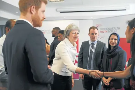  ?? /Reuters ?? Alternativ­es: Britain Prime Minister Theresa May and Prince Harry attend a Commonweal­th heads of government meeting youth forum in London on Monday. The Commonweal­th meeting with heads of state will offer the UK an opportunit­y to examine other trade...