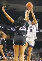  ?? Gina Ferazzi Los Angeles Times ?? JUJU WATKINS, shown shooting against La Jolla Country Day, has powered unbeaten Sierra Canyon.