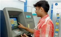  ?? Bloomberg ?? Usually, an ATM holds four cassettes — three of which can continue to be used for Rs 100, Rs 500, Rs 2,000, and the fourth cassette can be used for the new Rs 200 notes. However, there are many ATMs that only have either two or three cassettes. —