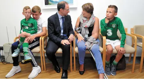  ??  ?? VISIT: Martin O’Neill with patient Josephine O’Brien Whitmarsh, sons John (7), Beineon (15) and Joseph (10), and, left, Roy Keane with patient Sr Augusta at Marymount hospital and hospice in its new interventi­onal pain service unit. Photo: Daragh McSweeney