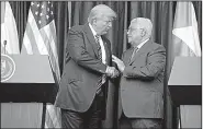  ?? AP/EVAN VUCCI ?? President Donald Trump and Palestinia­n President Mahmoud Abbas conclude an appearance Tuesday in the West Bank city of Bethlehem.