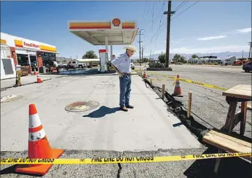  ?? Irfan Khan Los Angeles Times ?? ROGER SANDOVAL, 60, is afraid he might have to close his Shell gas station in Trona, Calif., which suffered major damage to its holding tanks in the recent 7.1 magnitude quake that struck in the Mojave Desert.