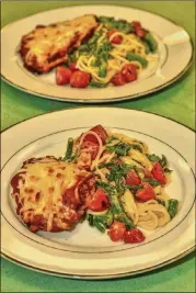  ??  ?? Finished and ready to eat, the Chicken Parmesan meal kit is plated with serving suggestion­s.