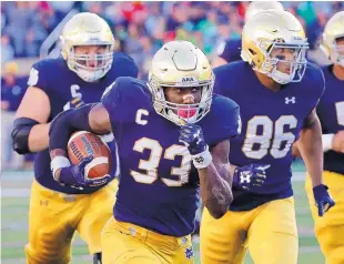  ?? CHARLES REX ARBOGAST/ASSOCIATED PRESS ?? Notre Dame running back Josh Adams rushed for 191 yards last week against USC and suddenly has worked his way into Heisman Trophy considerat­ion.