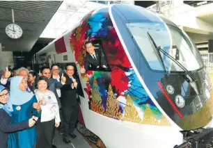  ??  ?? Liow in the driver’s seat of the newly launched KLIA Express train yesterday.