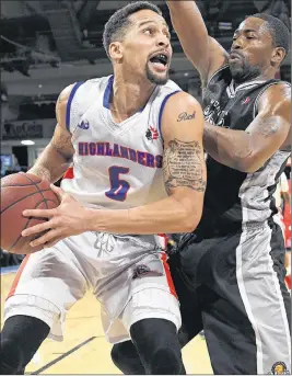  ?? VAUGHAN MERCHANT/CAPE BRETON HIGHLANDER­S ?? Rick Bodiford of the Cape Breton Highlander­s, left, is contested by Anthony Anderson of the Moncton Magic during National Basketball League of Canada action Thursday at Centre 200. Cape Breton lost, 135-105.