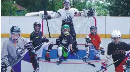  ?? PHOTO COURTESY OF CAMP TAMAKWA ?? Ball hockey and in-line skates are a great option when the weather is too warm for an outdoor ice rink.