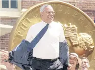  ?? REUTERS ?? Then US secretary of state Colin Powell laughs as he removes his jacket before the presentati­on of the Liberty Medal at Independen­ce Hall in Philadelph­ia, on July 4, 2002.