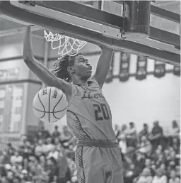  ?? ALEX GOULD/THE REPUBLIC ?? Liberty forward Ring Nyeri dunks against Pinnacle on Jan. 6. Nyeri averages 10.5 points and nine rebounds for the Lions.