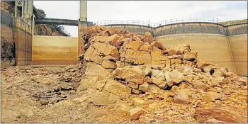  ??  ?? LOW LEVEL: Nelson Mandela Bay mayoral committee member Annette Lovemore sent The Herald this picture of the current state of the Churchill Dam. It was taken last week by Chandre Barnard, the metro’s deputy director: bulk water supply