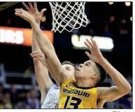  ?? AP file photo ?? Missouri forward Michael Porter Jr. (13), a preseason All-American, represents a resurgence in men’s college basketball among teams in the SEC, which sent five teams to the NCAA Tournament last season.