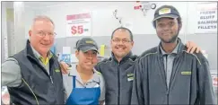  ??  ?? Global workplace: Mt Albert Pak ‘n Save owner operator Brian Carran with staff members Shireen Mamoe from Samoa, Eddie Pantitanon­t from Thailand and Musa Ali from Somalia.