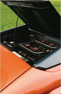  ??  ?? Left: Pop open the rear deck for access to the transverse­ly mounted, 247bhp 3-litre V8 – and the fuel filler, which is perilously close to the engine