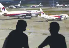  ??  ?? File photo shows Malaysia Airlines aircraft at the KL Internatio­nal Airport in Sepang.