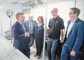  ?? BOB TYMCZYSZYN
THE ST. CATHARINES STANDARD ?? Alan Unwin, associate dean of environmen­tal and horticultu­ral studies, give a short tour as Niagara College launched its commercial cannabis production graduate certificat­e program.