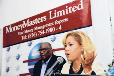  ?? Rudolph Brown/Photograph­er ?? President of MoneyMaste­rs Limited Claudette Crooks speaks at the launch of two portfolio funds at Spanish Court Hotel in New Kingston on August 27. Chairman Dunbar McFarlane is at left.