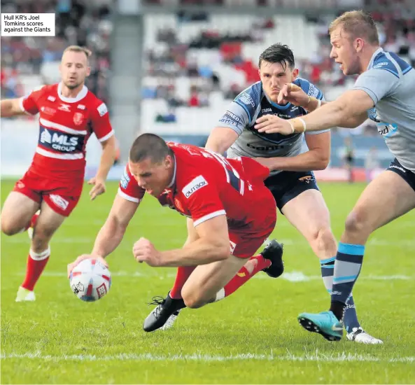  ??  ?? Hull KR’s Joel Tomkins scores against the Giants