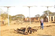  ??  ?? Councillor Sam Makuwerere at the solar-powered borehole that was done by World Vision, in partnershi­p with UNICEF