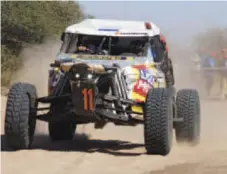  ??  ?? First Page: Fearless winner Giniel de Villiers in close proximity to equally fearless spectators.
This Page Top: Special rear-wheel-drive contenders.
This Page Middle: Fans of all ages and sizes enjoying motor sport in Botswana.
This Page Bottom:...