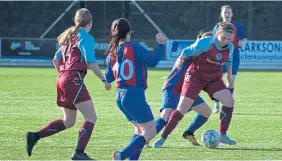  ??  ?? This Dryburgh U/17 player shakes off a Murieston defender.