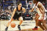  ?? Tyler Sizemore / Hearst Connecticu­t Media ?? UConn guard Lou Lopez Senechal plays in No. 5 UConn’s 91-69 win over No. 10 NC State at the XL Center in Hartford on Sunday.