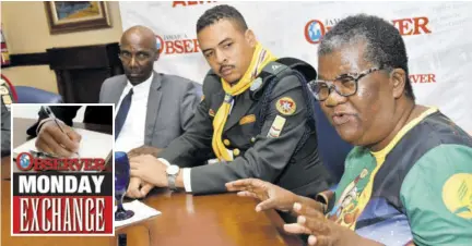  ?? (Photo: Karl Mclarty) ?? Retired educator and liaison officer for the internatio­nal groups for the Pathfinder Camporee Carol
Hunter (right) shares how the Seventh-day Adventist youth group has impacted the lives of youngsters. Looking on from left are President of the Seventh-day Adventist Church in Jamaica Pastor Everett Brown and youth ministries director for the East Jamaica Conference of Seventh-day Adventist Pastor Joel Jump.