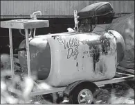  ?? Arkansas Democrat-Gazette/BENJAMIN KRAIN ?? A charred hot-dog cart sit outside the Bragg Street home of Ean Bordeaux after an altercatio­n Friday between the hot-dog vendor and a former Little Rock police officer who died afterward. Video is available at arkansason­line.com/video
