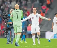  ??  ?? Wayne Rooney embraces Brad Guzan after the match