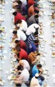  ??  ?? RIYADH: Muslims break their fast, with a meal known as the ‘Iftar’ during the Muslim holy fasting month of Ramadan in Riyadh. — AFP