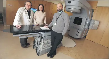 ?? TYLER BROWNBRIDG­E ?? Dr. Ken Schneider, Monica Staley Liang and Jeff Richer are shown in the radiation treatment area of the Windsor Regional Cancer Centre on Wednesday. In Windsor, radiation was delivered with more than 95 per cent accuracy in three separate tests .