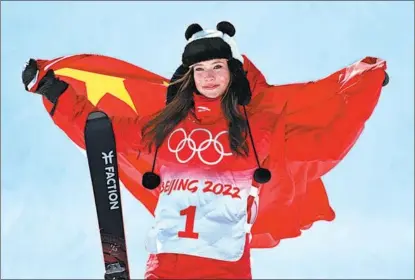  ?? WEI XIAOHAO / CHINA DAILY ?? Chinese athlete Gu Ailing attends a ceremony presenting souvenirs after winning gold in the women’s freestyle ski halfpipe at the Winter Olympics in Zhangjiako­u, Hebei province, on Feb 18.