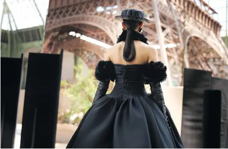  ?? PHOTOS: CHANEL ?? Models show Karl Lagerfeld’s latest collection in Paris’s Grand Palais, featuring a 38-metre reproducti­on of the Eiffel Tower.