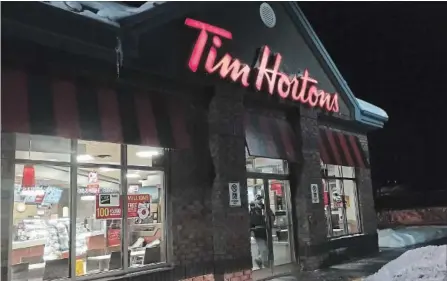  ?? DOUG IVES THE CANADIAN PRESS ?? Amid a franchisee­s’ revolt in Canada, where sales continue to be sluggish, the parent company of Tim Hortons reports better than expected profits.