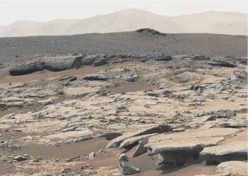  ?? PICTURE: AFP/GETTY IMAGES ?? 0 Despite the rocky, dry surface of Mars, a briny lake has been found under a polar ice cap