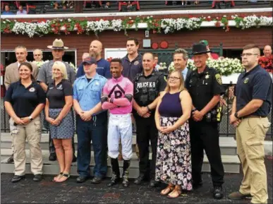  ?? PAUL POST — PPOST@DIGITALFIR­STMEDIA.COM ?? Nearly a dozen agencies were represente­d in the Winner’s Circle as part of First Responders Day activities at Saratoga Race Course on Wednesday.