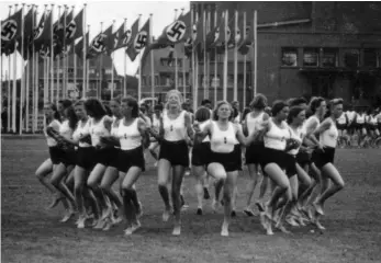  ??  ?? Dutch teenage girls, members of the National Youth Storm — modelled after the Hitler Youth organizati­on in Germany — dance at a pro-Nazi festival in July 1941. At its peak, the Youth Storm had more than sixteen thousand members.