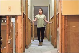  ?? / AP-Gerry Broome ?? Danielle Rees, with the repairs underway, stands in her home near Washington, N.C. Floodwater­s rose about 15 inches into Rees’ home in September when Hurricane Florence drenched this tidewater city on the Pamlico River and overwhelme­d a local creek and marshland. “It’s part of living close to the river, and Washington is really low land,” said Rees, a graphic designer who grew up in the city.