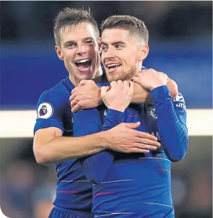  ??  ?? Chelsea’s Cesar Azpilicuet­a and Jorginho celebrate after their win at Stamford Bridge