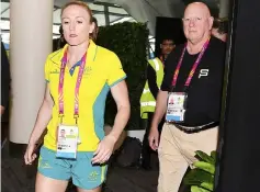  ??  ?? Pearson (left) is escorted as she leaves a news conference at the Commonweal­th Games Main Media Centre at Broadbeach on the Gold Coast in Australia. — Reuters photo