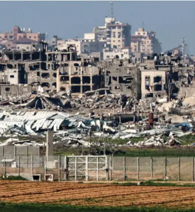  ?? AFP, Reuters ?? Clockwise from top, destroyed buildings in the Gaza Strip as seen from the southern border with Israel; displaced Palestinia­ns travel from Khan Younis towards Rafah after being urged to flee; Israeli soldiers inspect a tunnel in Khan Younis, which the army claims had been dug by Hamas militants operating in Gaza