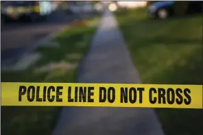  ?? (AP/Matt Rourke) ?? Police tape cordons off the scene of a crime in Levittown, Pa., on Saturday.