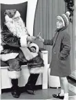  ?? FILE PHOTO BY JACK CORN, THE TENNESSEAN, VIA USA TODAY NETWORK ?? In 1966, Kathy Diviney, 5, gets a lollipop from Santa at the Sears in downtown Nashville.