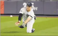  ?? Seth Wenig / Associated Press ?? New York Yankees right fielder Aaron Judge makes a diving catch on a ball hit by the Minnesota Twins’ Jorge Polanco during the third inning of Game 1 of the American League Division Series in October.